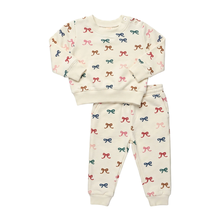 Cream Baby Bow Jogger Set featuring a long sleeve sweatshirt and matching jogger pants with colorful all-over bow print