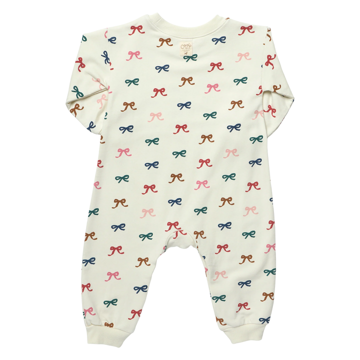 Back view of cream Baby Bow Romper featuring an all-over colorful bow print, long sleeves and ribbed ankle cuffs