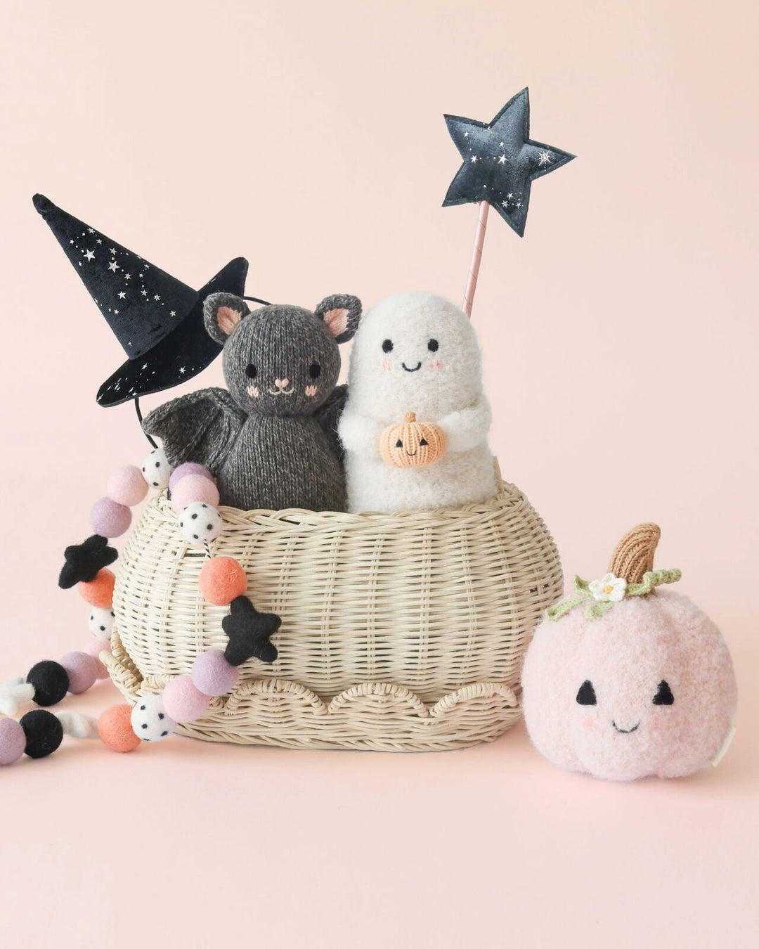 Baby Ghost with Pumpkin styled in a Halloween basket with a knit bat and pastel pumpkin