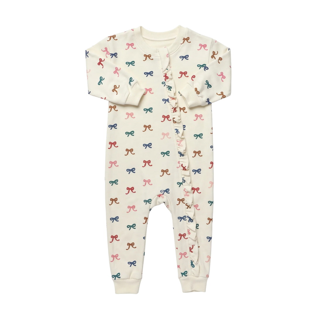 Baby Girl Bow Romper in cream featuring colorful pink, blue, green and brown bows with front ruffle detail and long sleeves