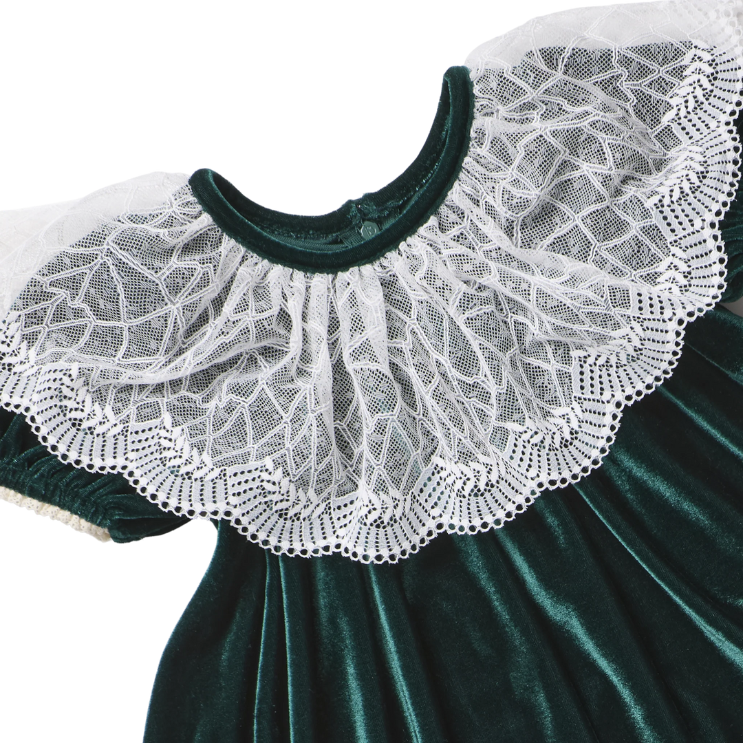 Close-up of the delicate white lace collar and rich evergreen velour fabric on the Pink Chicken Caroline Dress