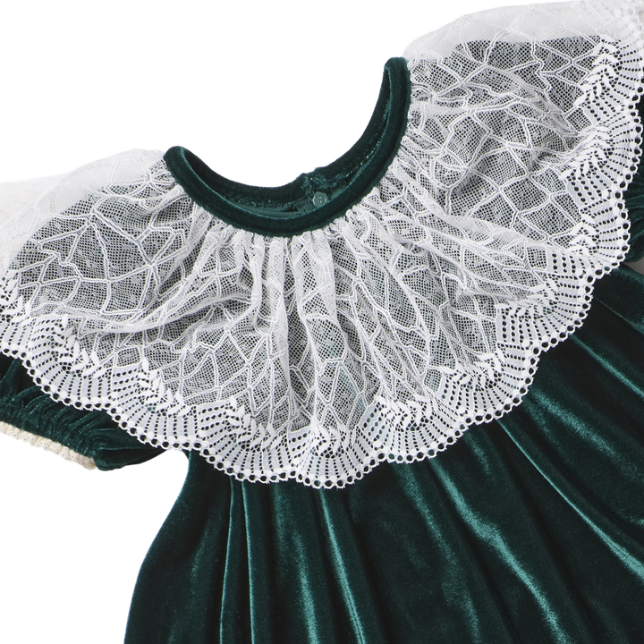 Close-up of the delicate white lace collar and rich evergreen velour fabric on the Pink Chicken Caroline Dress