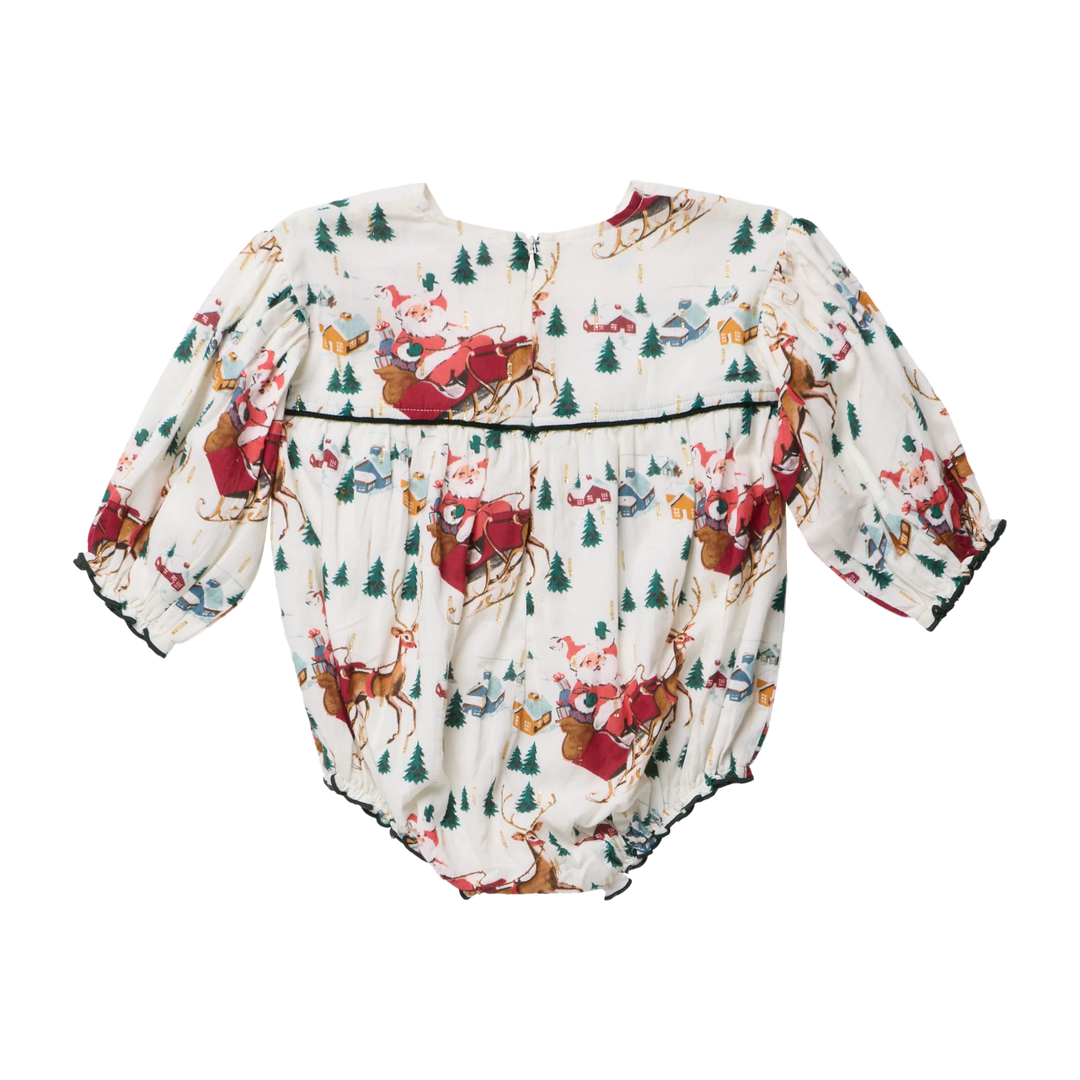 Back view of Pink Chicken Baby Girls Wynne Bubble showing Santa Sleigh print, gathered fabric, green trim, and back zipper