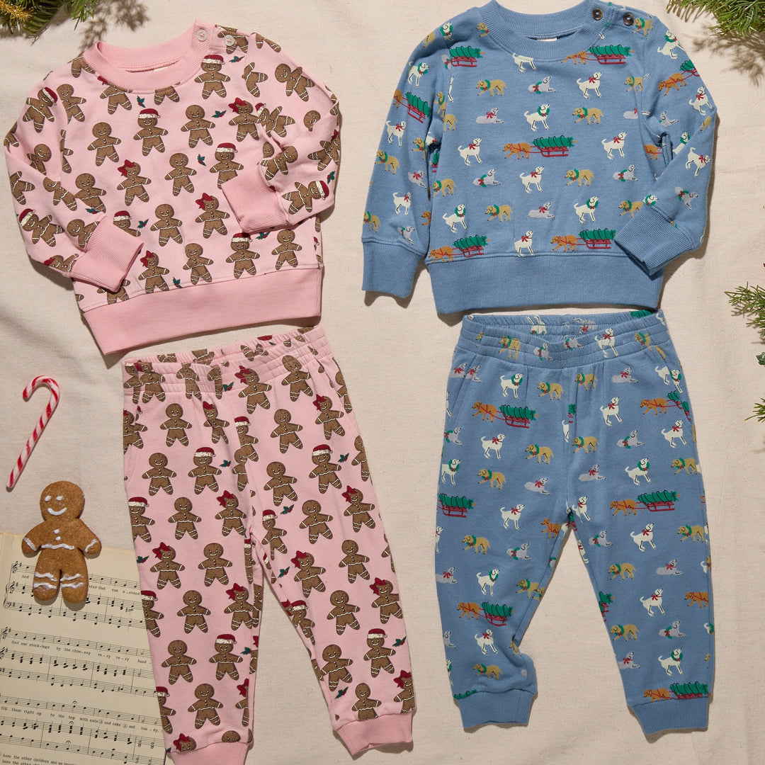 Blue Holiday Labs Baby Jax Jogger Set displayed alongside pink gingerbread holiday outfit