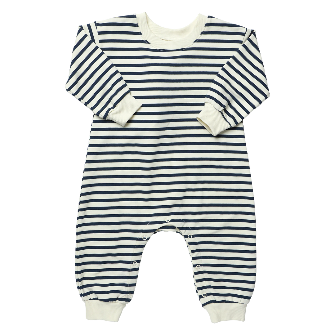 Baby navy striped romper with cream and navy horizontal stripes, long sleeves, ribbed cuffs, and snap closures along the legs.