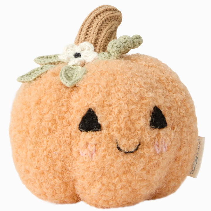 Baby Pumpkin Moonflower plush toy with soft orange texture, smiling face, green leaves, white flower and knit stem