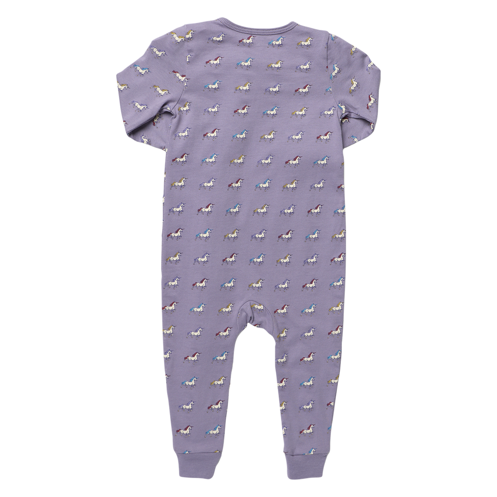Back view of purple baby unicorn romper featuring a colorful allover unicorn print, long sleeves, and ribbed ankle cuffs.
