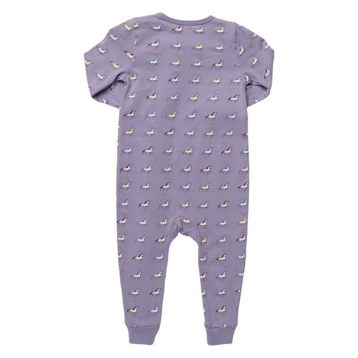 Back view of purple baby unicorn romper featuring a colorful allover unicorn print, long sleeves, and ribbed ankle cuffs.