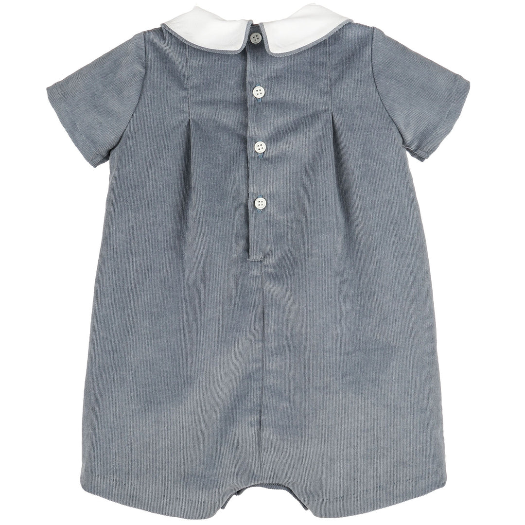 Back view of Blue Heirloom Corduroy Bubble for baby boys with blue corduroy, white Peter Pan collar, short sleeves, and button-back closure.