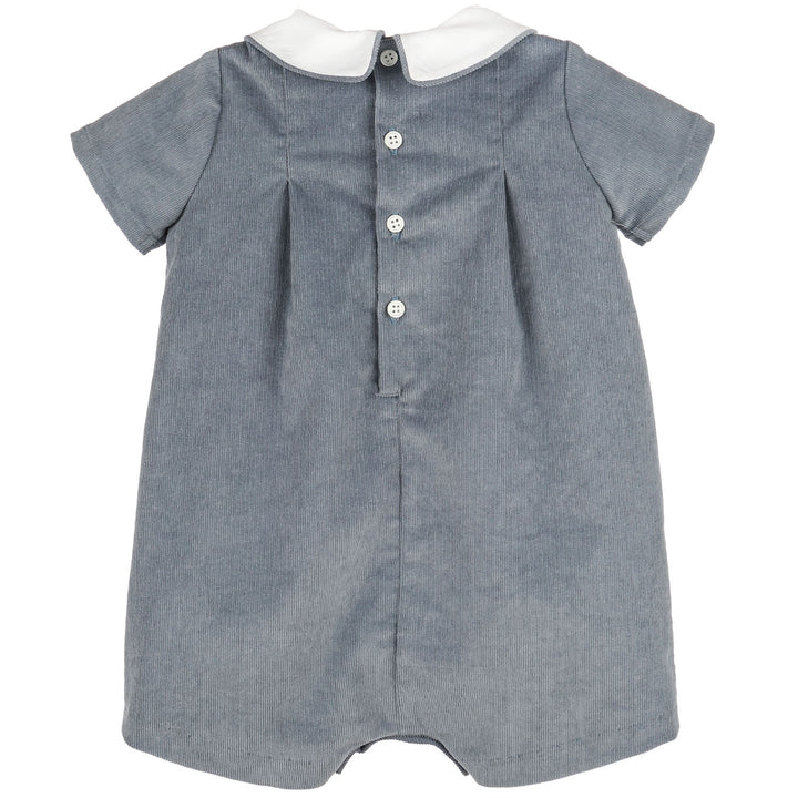Back view of Blue Heirloom Corduroy Bubble for baby boys with blue corduroy, white Peter Pan collar, short sleeves, and button-back closure.
