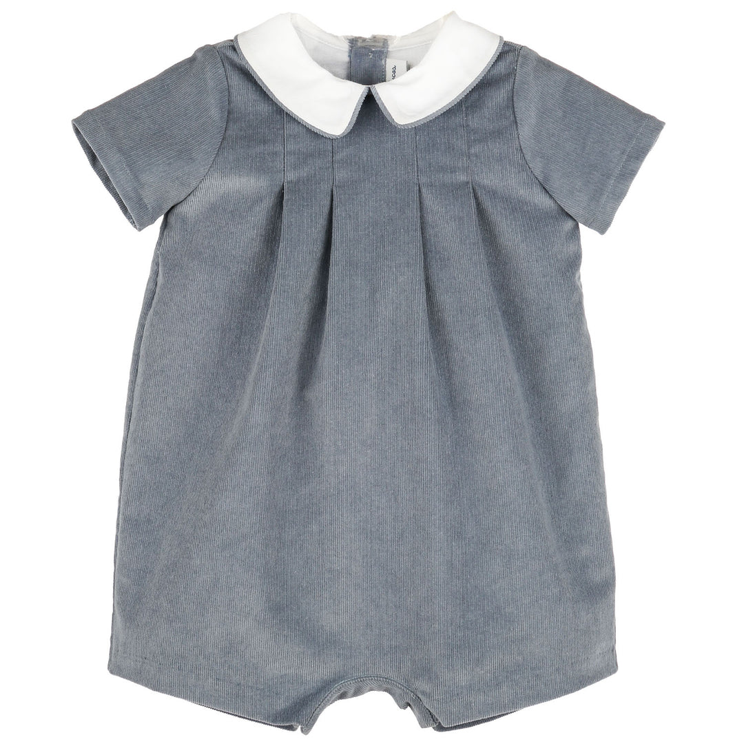 Front view of Blue Heirloom Corduroy Bubble for baby boys featuring blue corduroy, short sleeves, white Peter Pan collar, and classic pleated front.