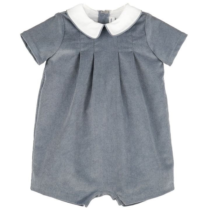 Front view of Blue Heirloom Corduroy Bubble for baby boys featuring blue corduroy, short sleeves, white Peter Pan collar, and classic pleated front.