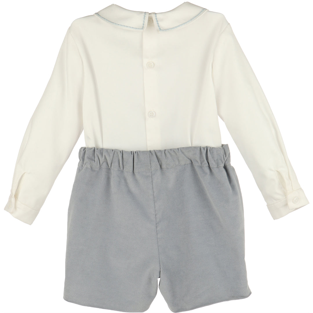 Back view of Blue Minicorduroy Set for boys featuring a white long sleeve shirt and blue corduroy shorts with elastic waist