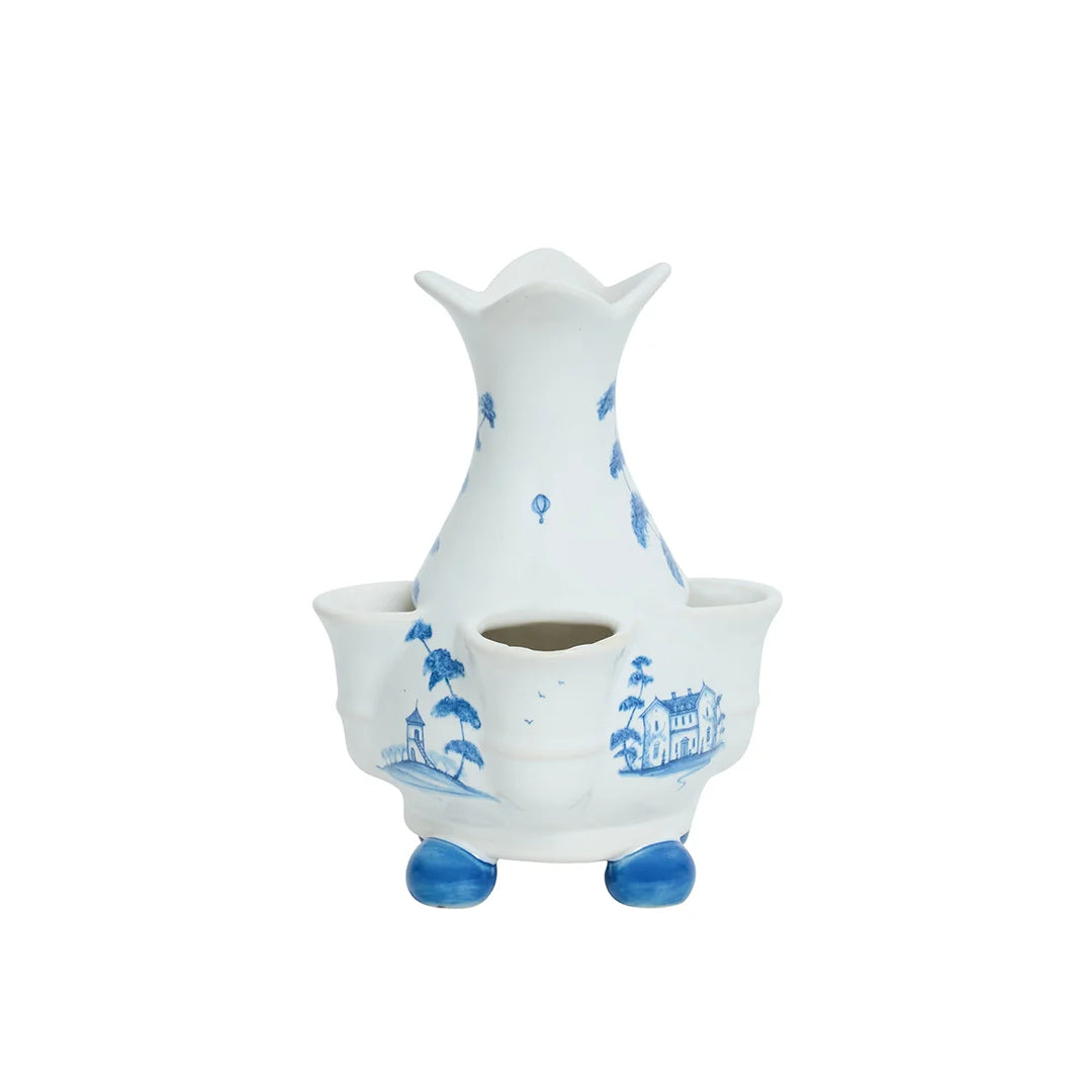 Back view of blue and white chinoiserie bud vase showing scenic house, tree and landscape illustrations