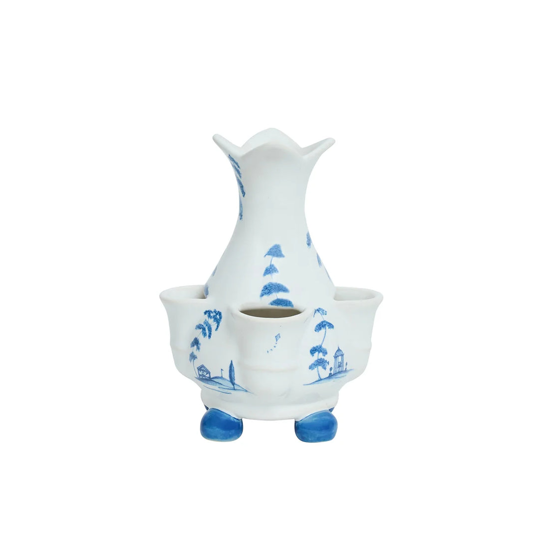 Side view of blue and white chinoiserie multi-bud vase with delicate scenic motifs and individual flower openings