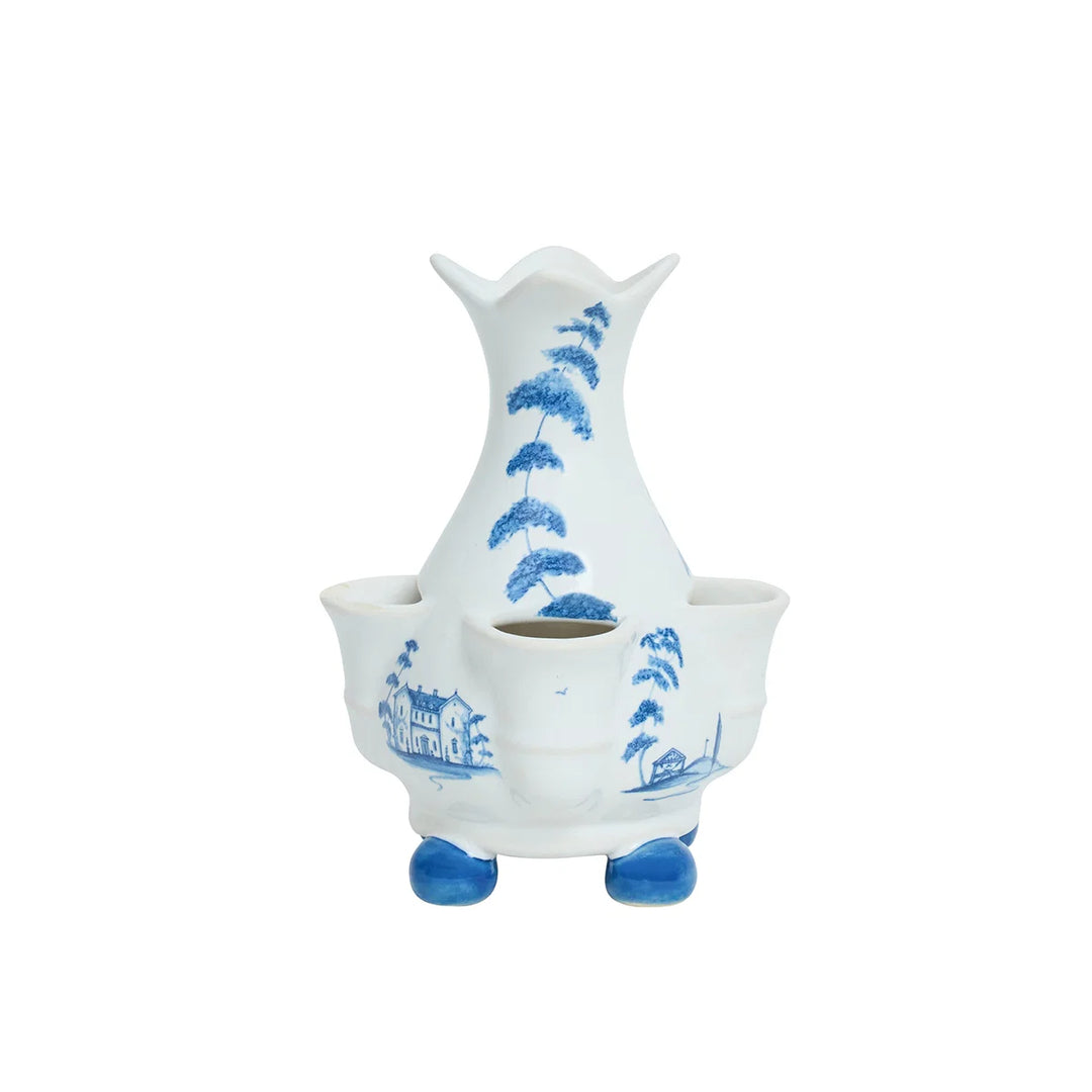 Blue and white chinoiserie bud vase with multiple flower openings, scenic landscape details and blue feet