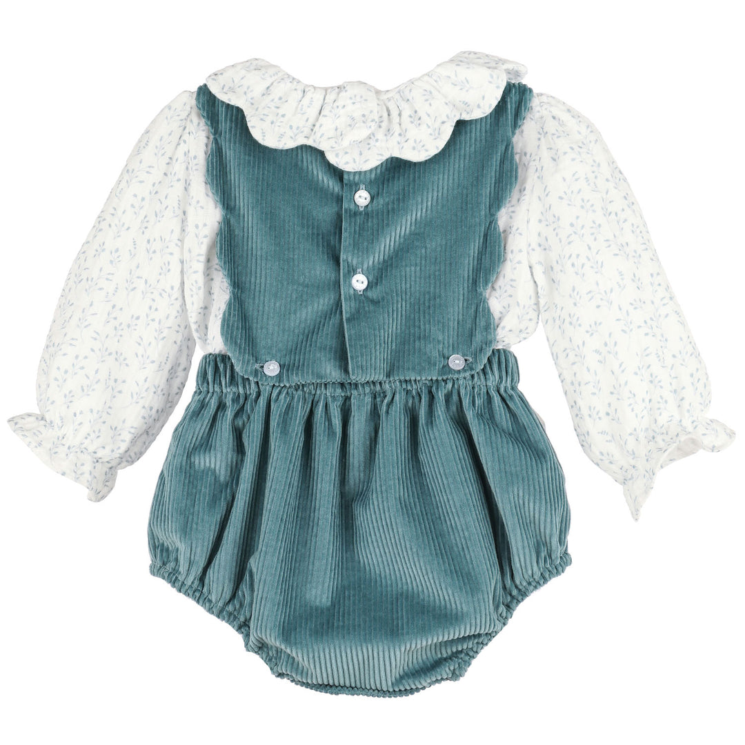 Back of Blue Willow OG Overall featuring blue corduroy, floral long sleeves, ruffle collar, and button details