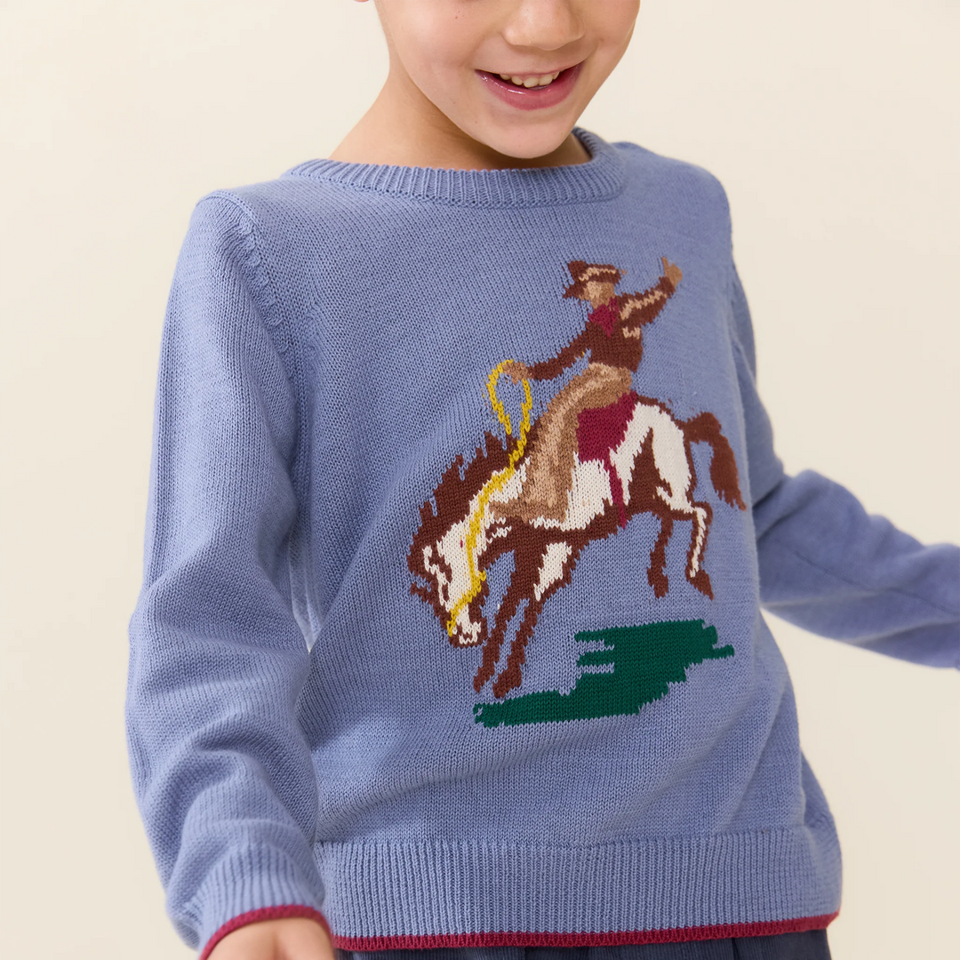 Close-up of Boys Bronco Sweater featuring colorful cowboy and bucking horse knit design