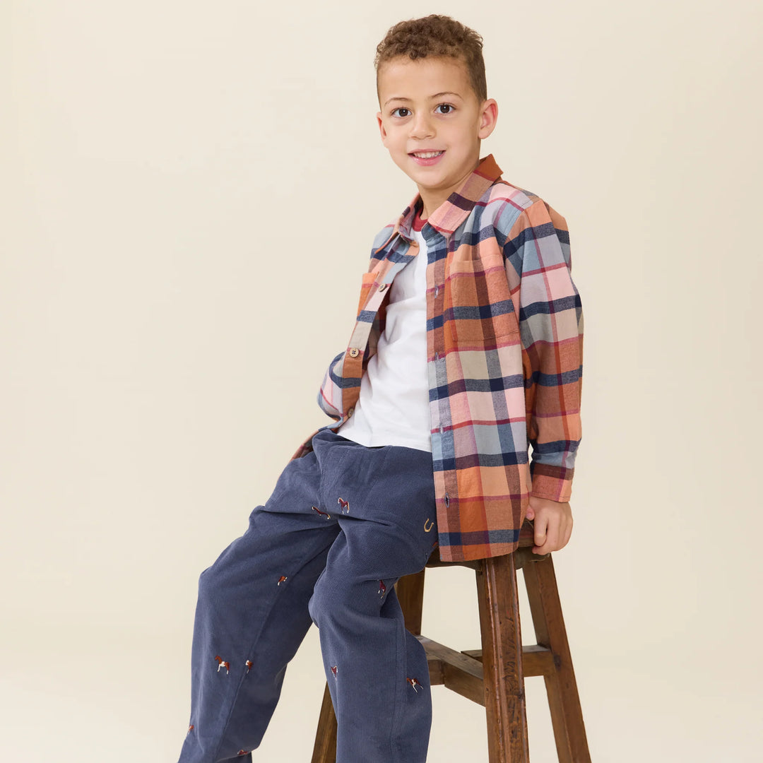 Boy styling the Boys Hayride Plaid Shirt with navy pants for fall
