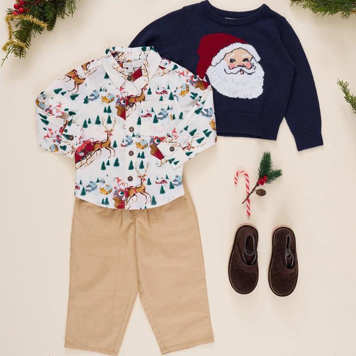 Pink Chicken Santa Sleigh Jack Shirt styled with a Santa sweater, khaki pants, and brown shoes