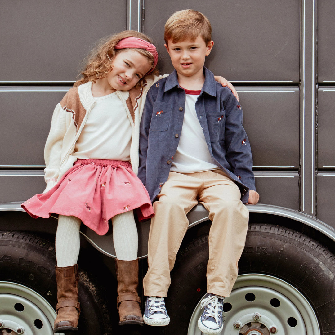 Boys Navy Horse Embroidered Shirt styled with khaki pants for a coordinating sibling fall outfit