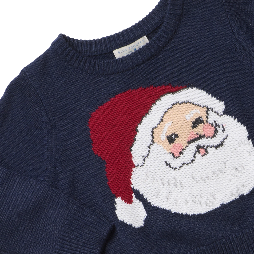 Close-up of Boys Oliver Sweater Navy Santa showing the knit Santa design, ribbed neckline, and navy fabri