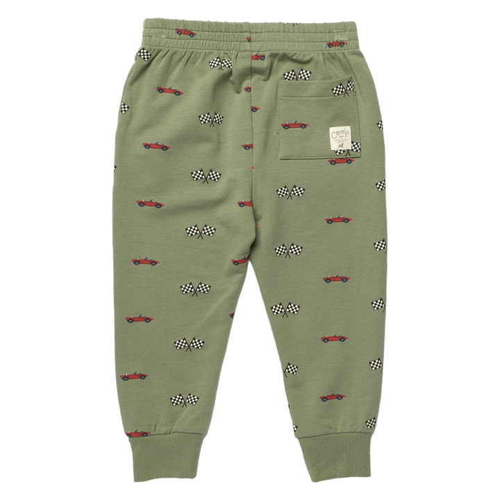 Back view of boys olive green race car jogger pants with red cars, checkered flags, cuffed ankles and back patch pocket
