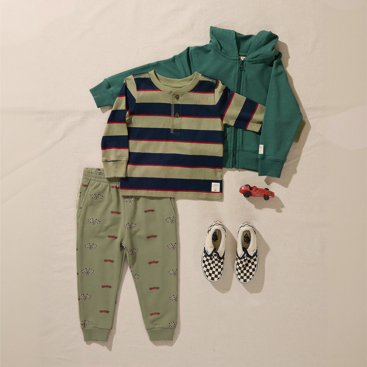Boys olive green race car jogger pants styled with a striped shirt, green zip hoodie and checkered shoes