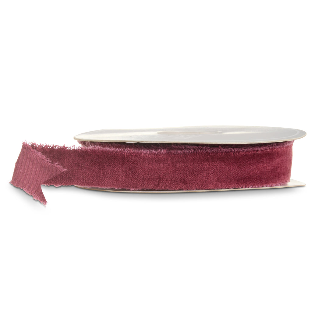 Burgundy velvet torn edge ribbon on a roll featuring a rich wine red color and soft textured finish for Christmas decorating, wreaths, garlands, and holiday bows.