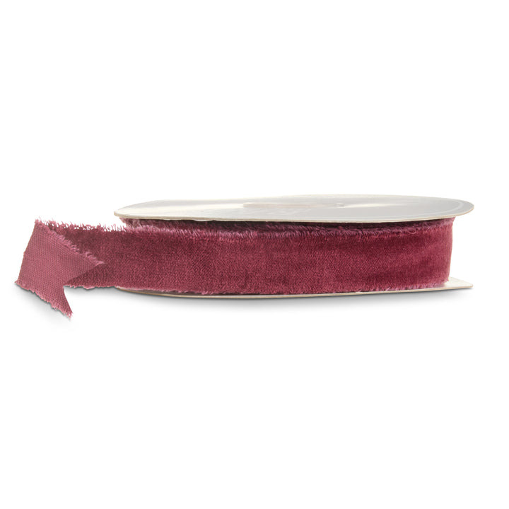 Burgundy velvet torn edge ribbon on a roll featuring a rich wine red color and soft textured finish for Christmas decorating, wreaths, garlands, and holiday bows.