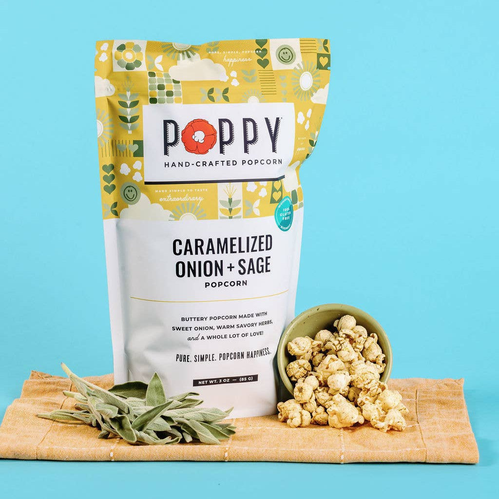 Poppy Caramelized Onion + Sage popcorn with a bowl of popcorn and fresh sage