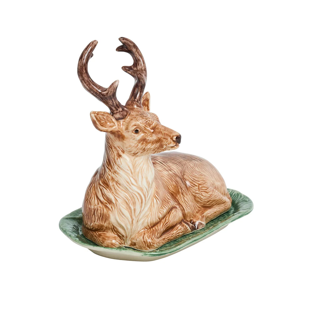 Ceramic deer butter dish featuring a detailed resting stag with brown antlers on a textured green serving tray.