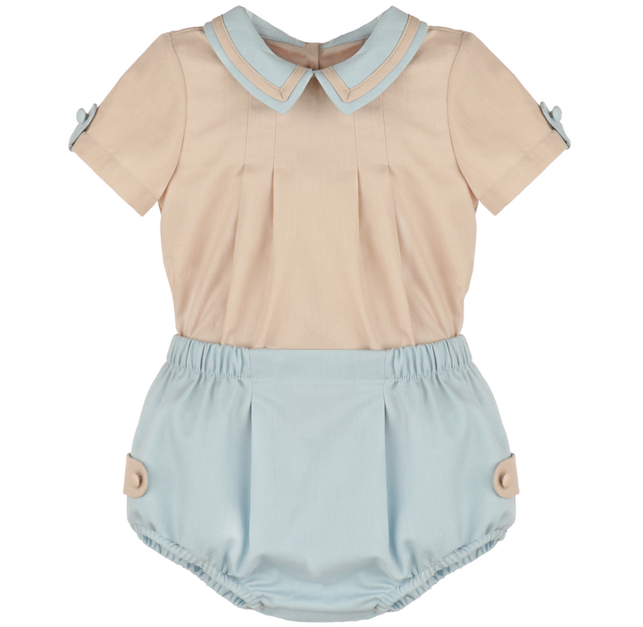 Front view of Chambray &amp; Oatmeal baby boy set with oatmeal short-sleeve top, chambray Peter Pan collar, pleated front, and blue bloomers.
