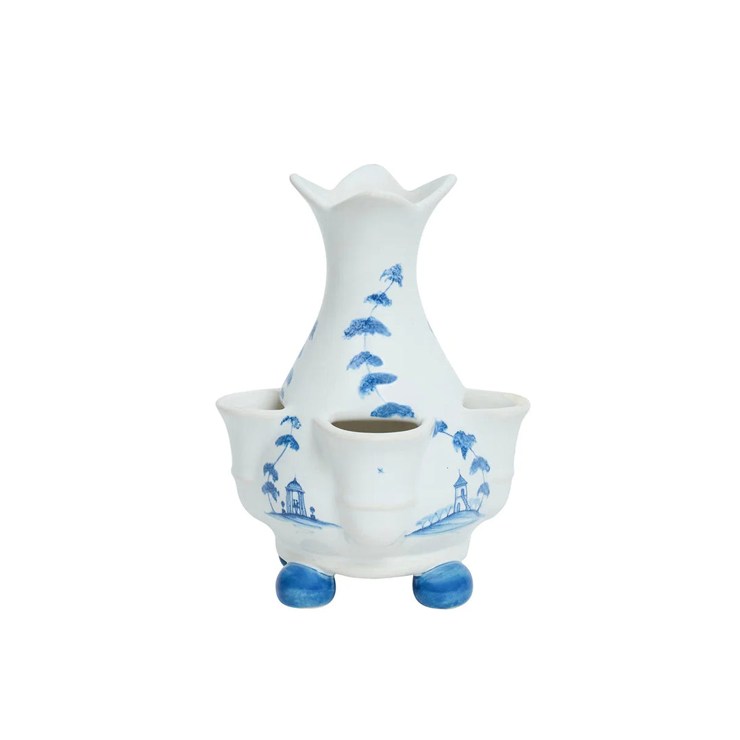 Blue and white multi-opening bud vase featuring hand-painted style trees, architectural scenes and blue feet