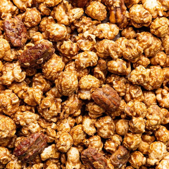 Close-up of Cinnamon Bourbon Pecan Hand-Crafted Popcorn with maple pecans