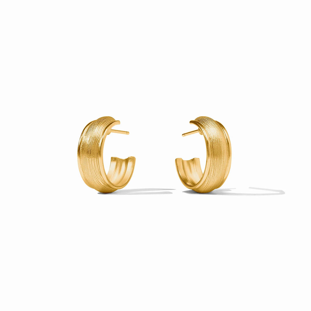 Angled view of Cobblestone Hoop Earrings with textured gold finish