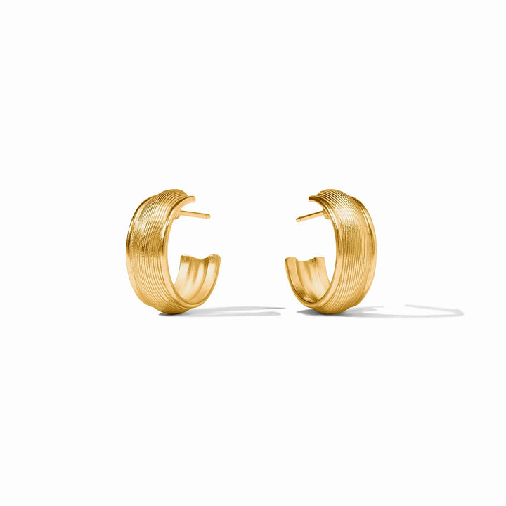 Angled view of Cobblestone Hoop Earrings with textured gold finish