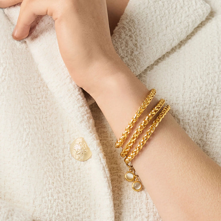 Gold Cobblestone Link Bracelet stacked with coordinating chain bracelets on wrist