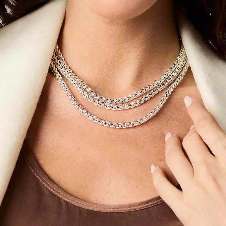 Close-up of silver Cobblestone Link Necklace featuring woven chain design