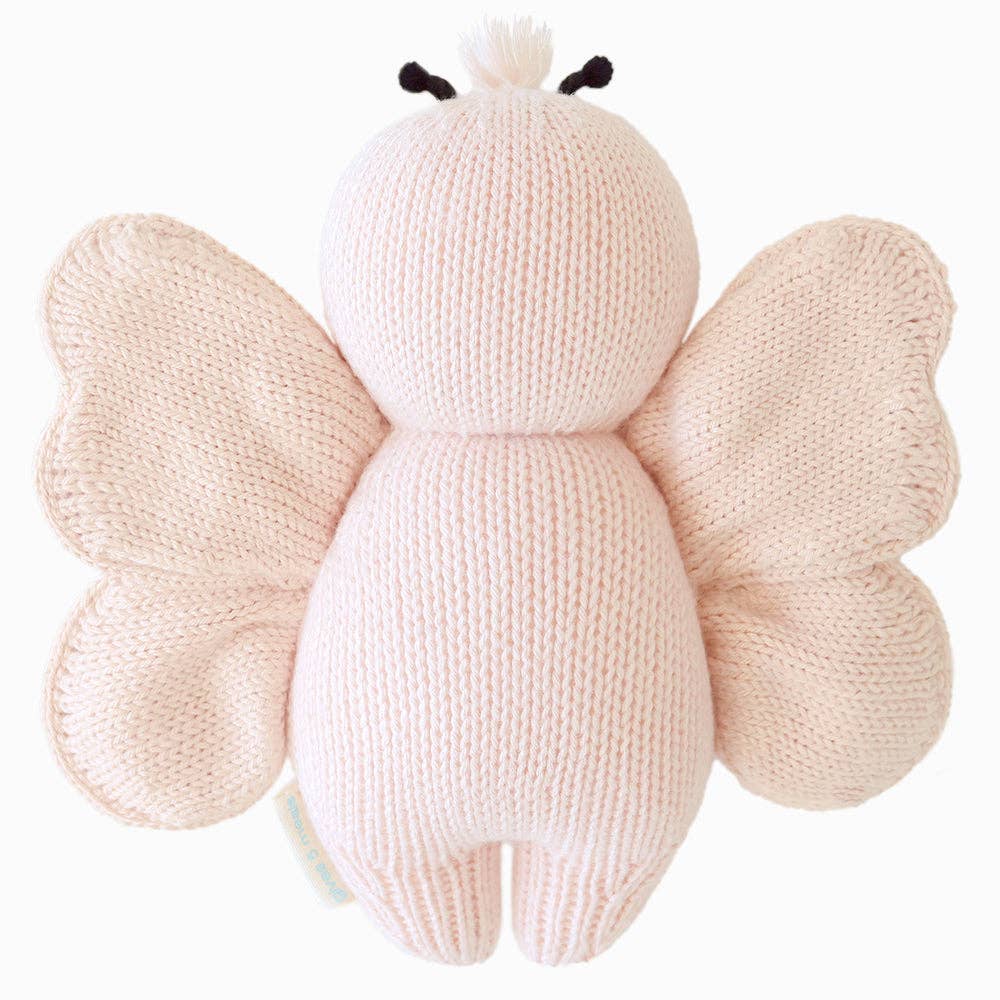 Flat image of the back of Cuddle+Kind's petal pink Baby butterfly on a clean white background