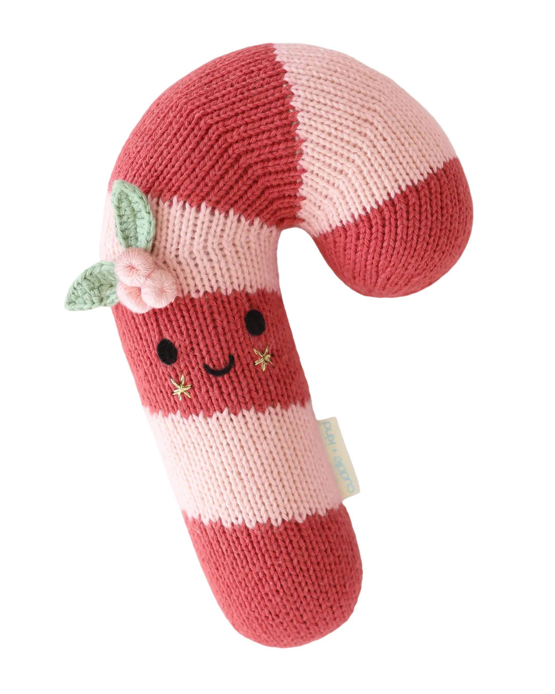 Flat product image of Cuddle+Kind's Christmas Baby Candy Cane in the color scheme, blush stripe. Complete with a smiling face and star cheeks. 