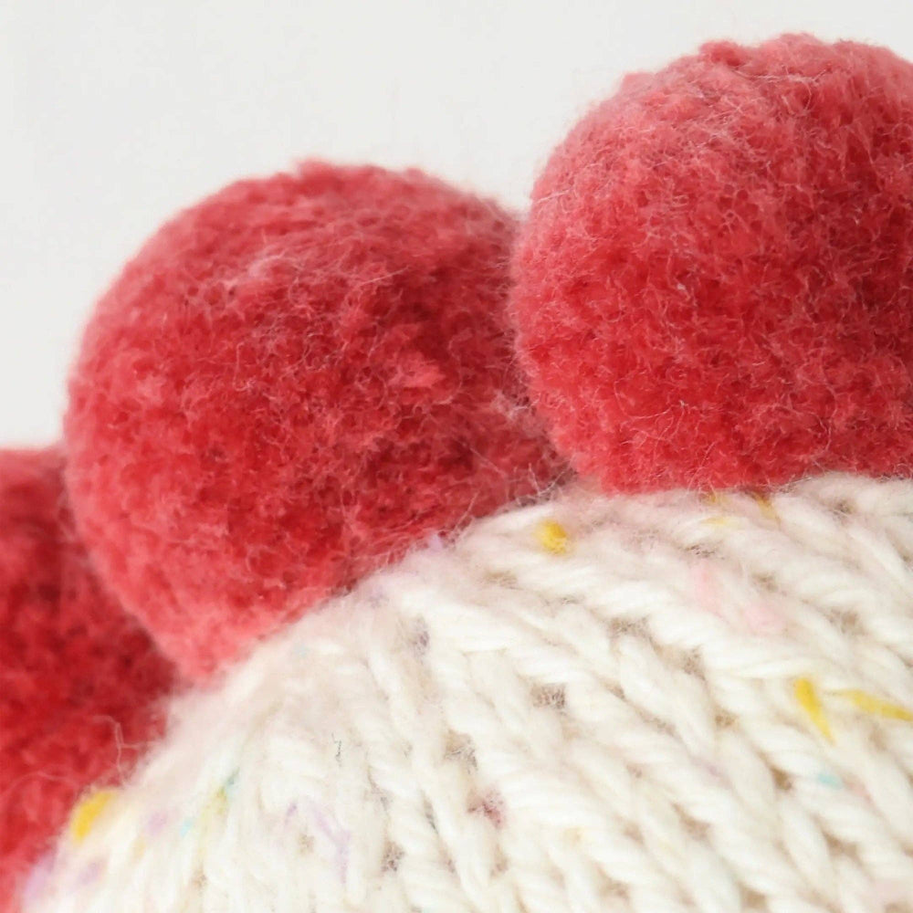 Close up image of the detailing on the head of Cuddle+Kind's Baby Chicken