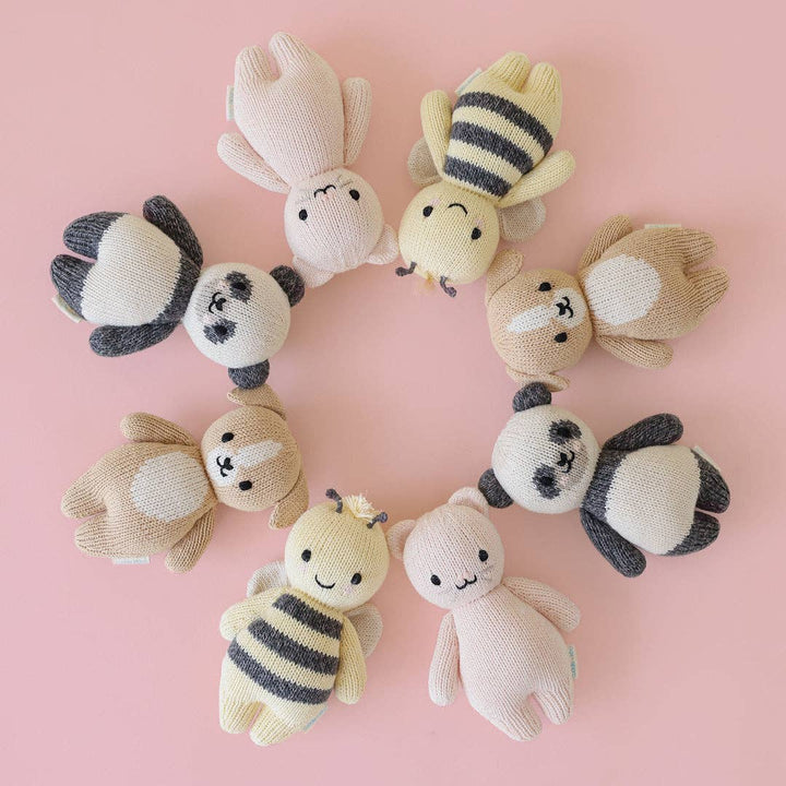 Cuddle+Kind Baby Panda plush staged with their Baby bee, Baby Puppy, and Baby Kitten in circle