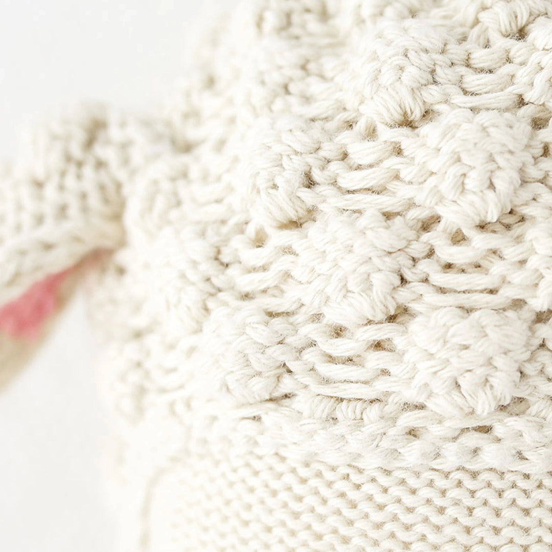 Close up image of the head stitch detailing on Cuddle+Kind&