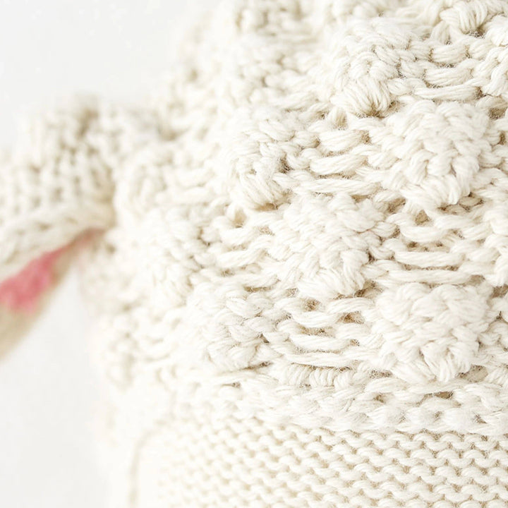 Close up image of the head stitch detailing on Cuddle+Kind&