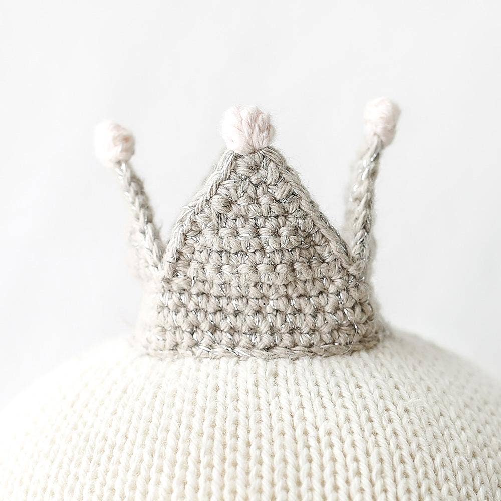 Close up image of the grey crown worn by Cuddle+Kind&