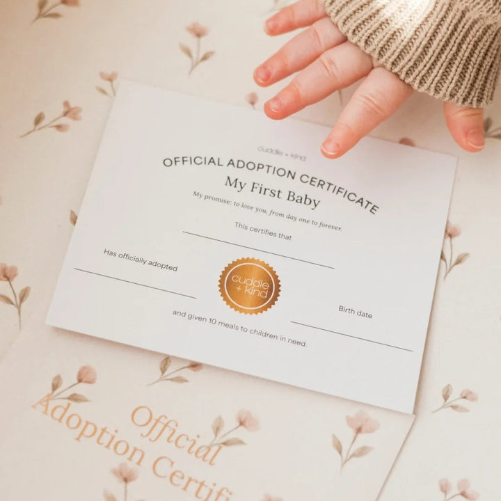Image of the adoption certificate that comes with Cuddle+Kind&