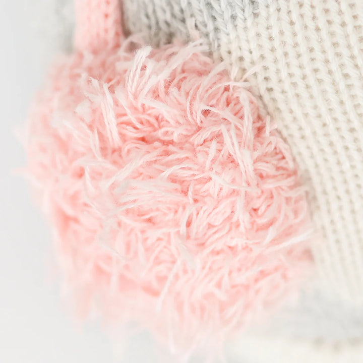 Close up shot of the pink fluffy earmuffs worn by Cuddle and Kind&