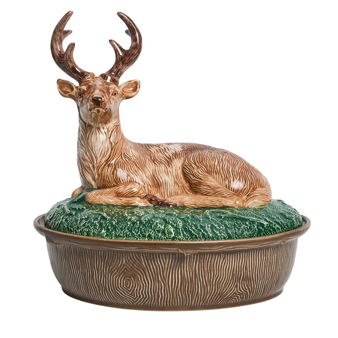 Ceramic deer covered serving dish featuring a sculpted resting stag lid, green woodland details and brown woodgrain-style bowl.