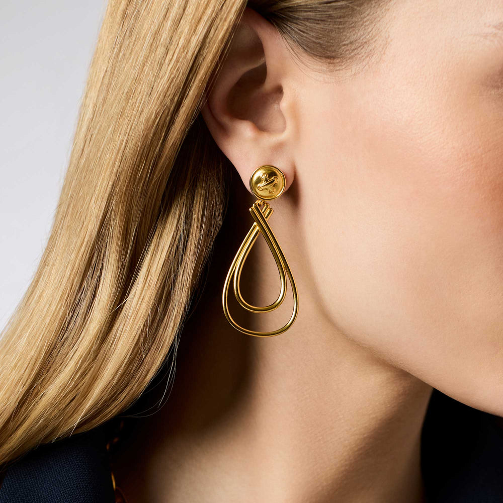 Gold Essex Earring with double teardrop design worn on model